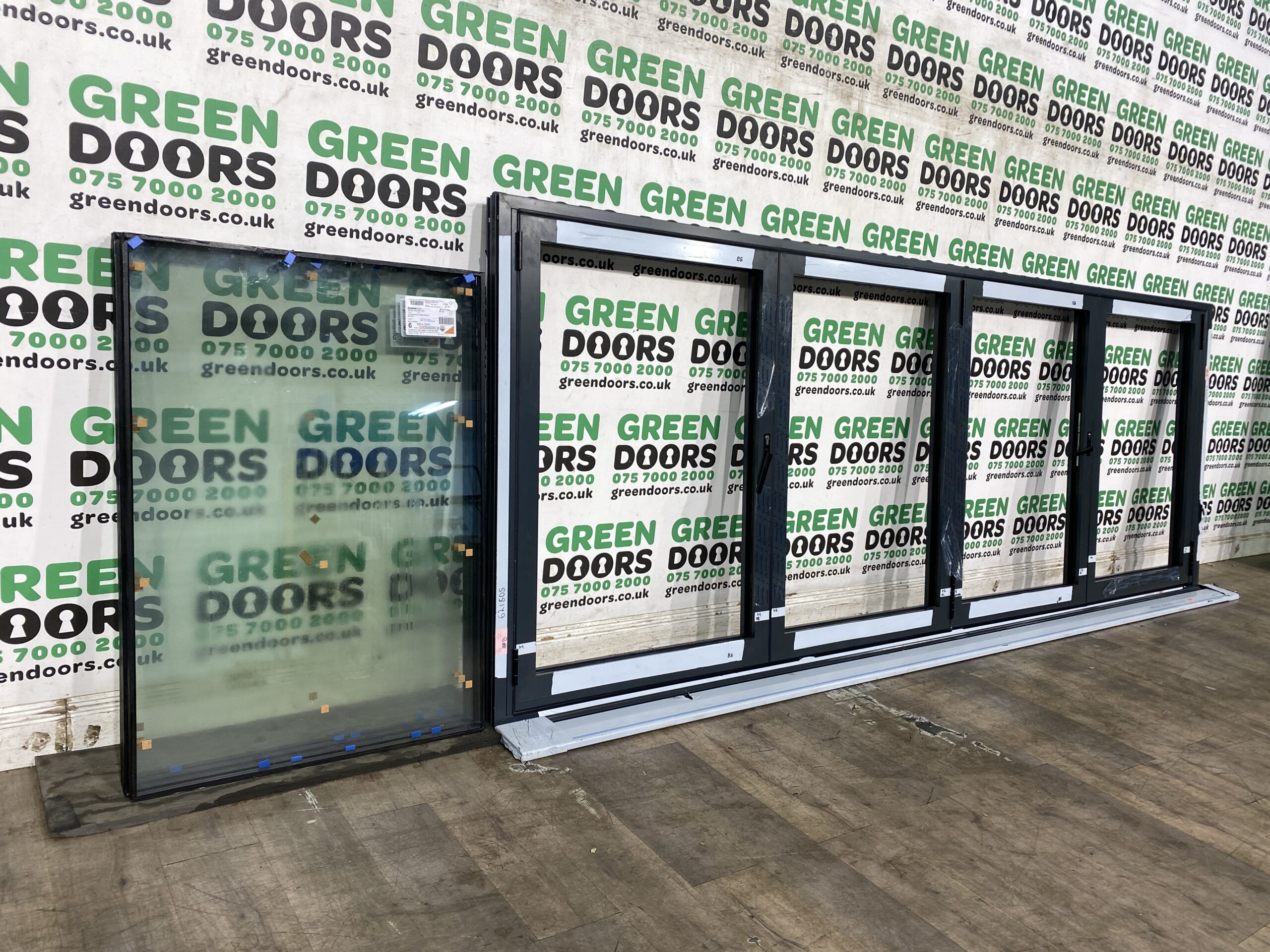 Grey Bi-folding window | Green doors